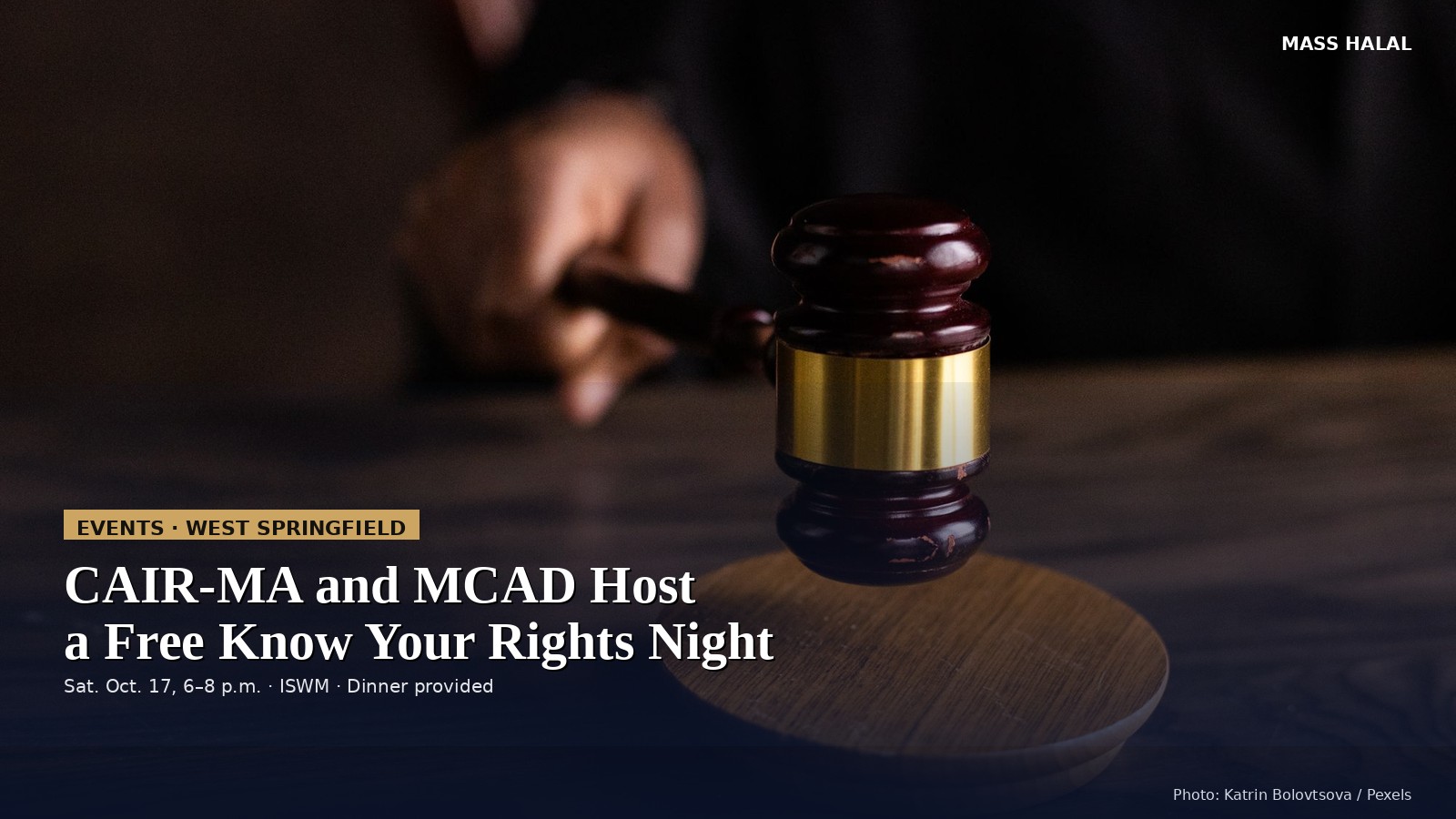 A wooden gavel with a gold band.