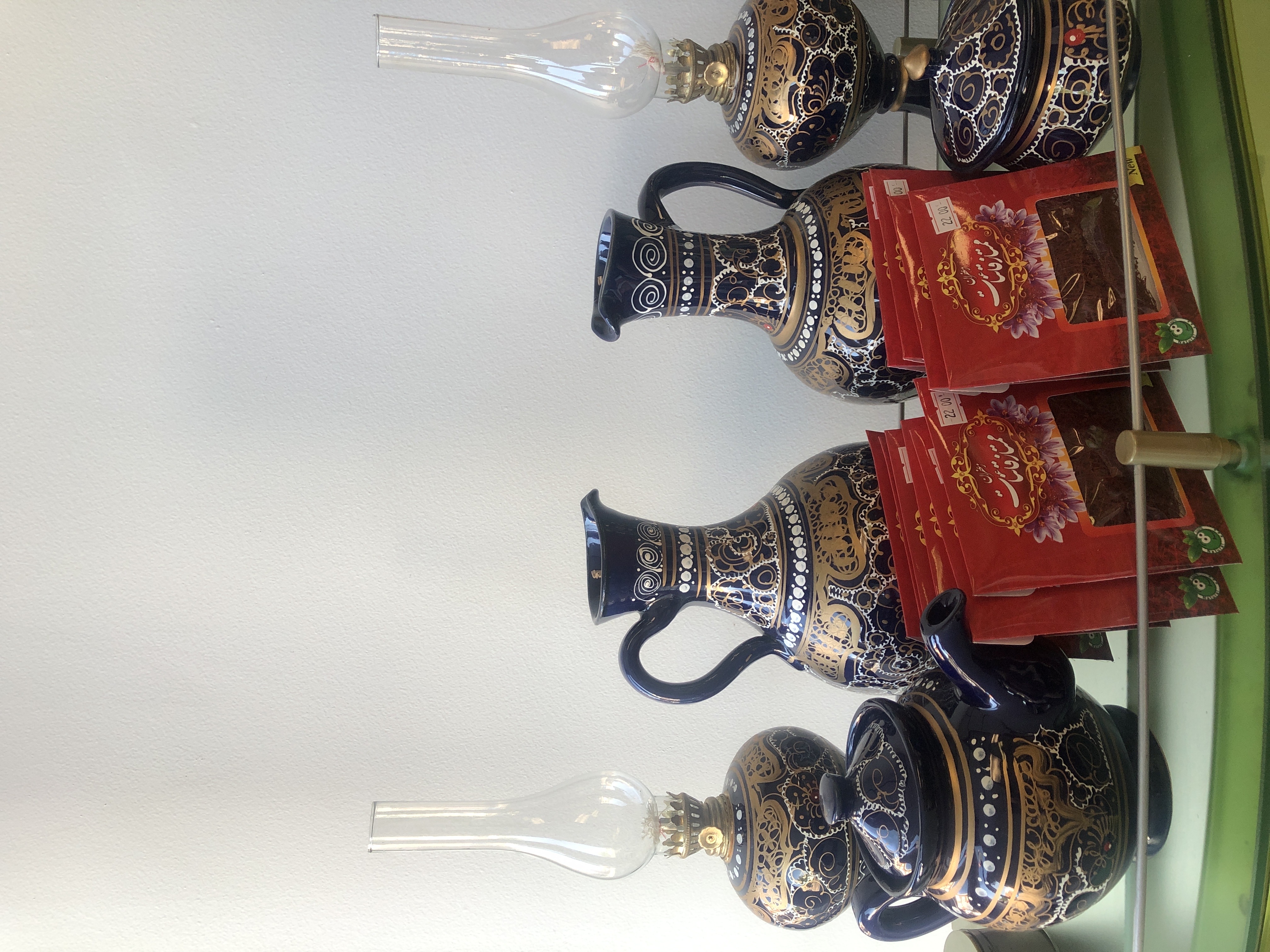 Tea accessories and packaged spices displayed at Iryana Market